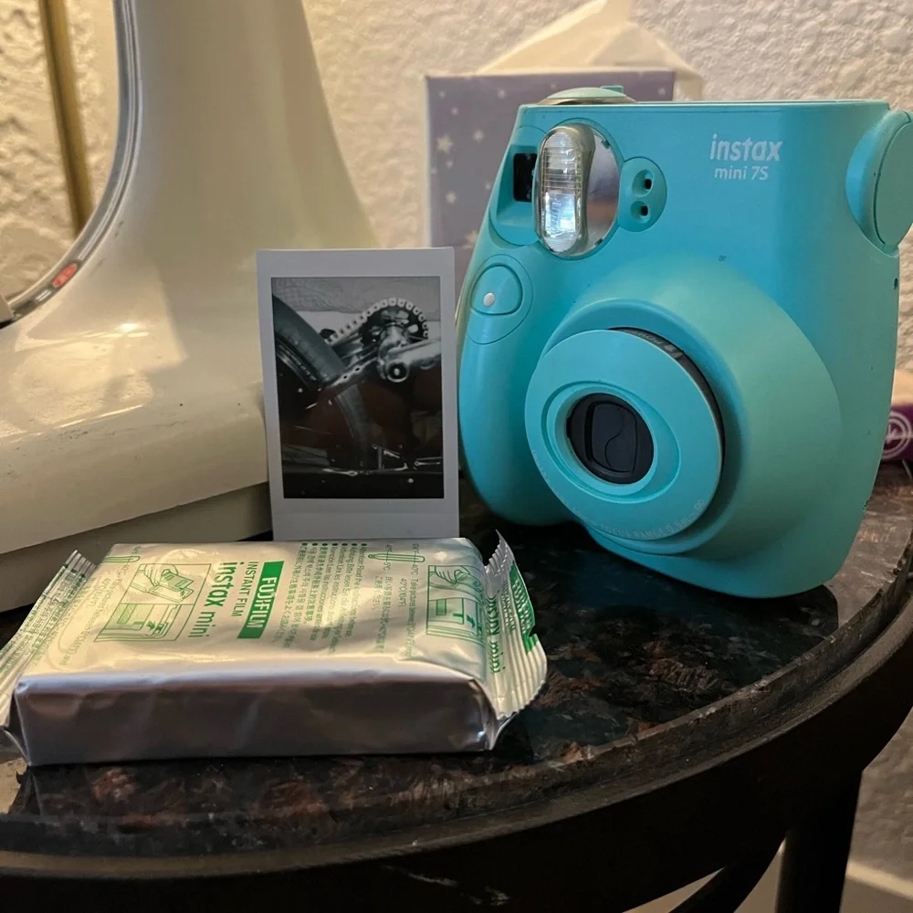 Polaroid camera made by Fujifilm called the Instax mini 7s